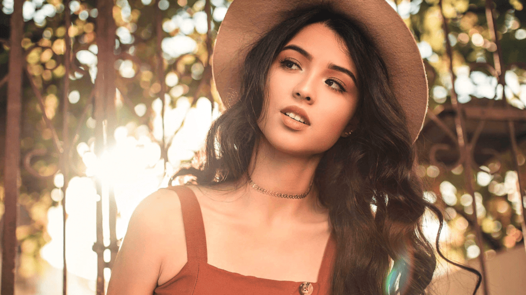 Woman wearing tomato girl makeup and hat