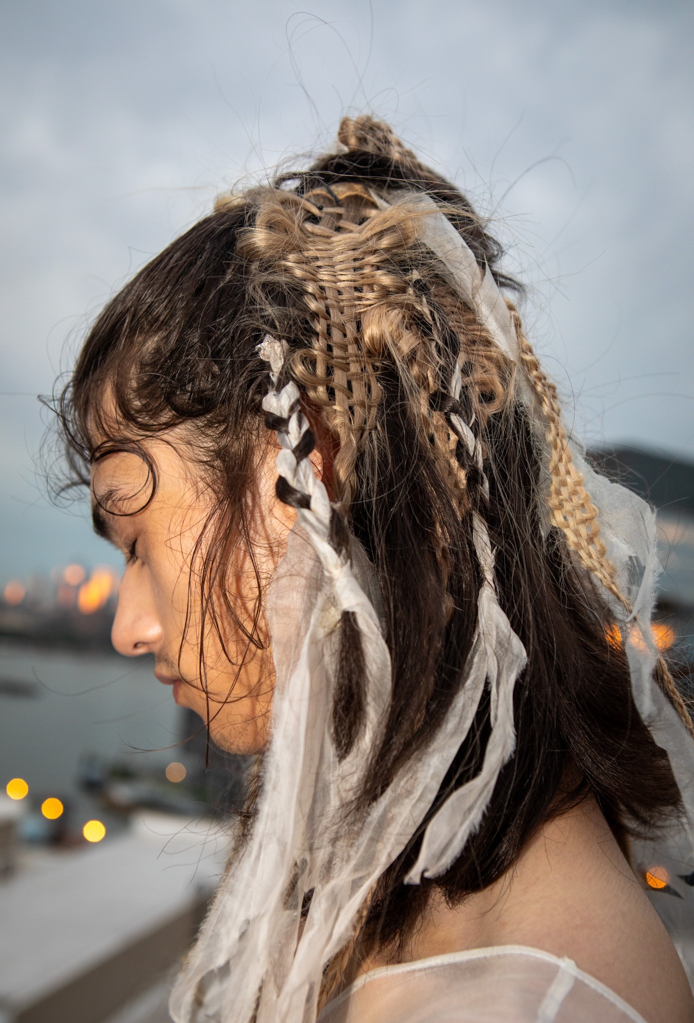 Braids with fabric hairstyling for the collina strada NYFW SS’24 runway by Evanie Frausto