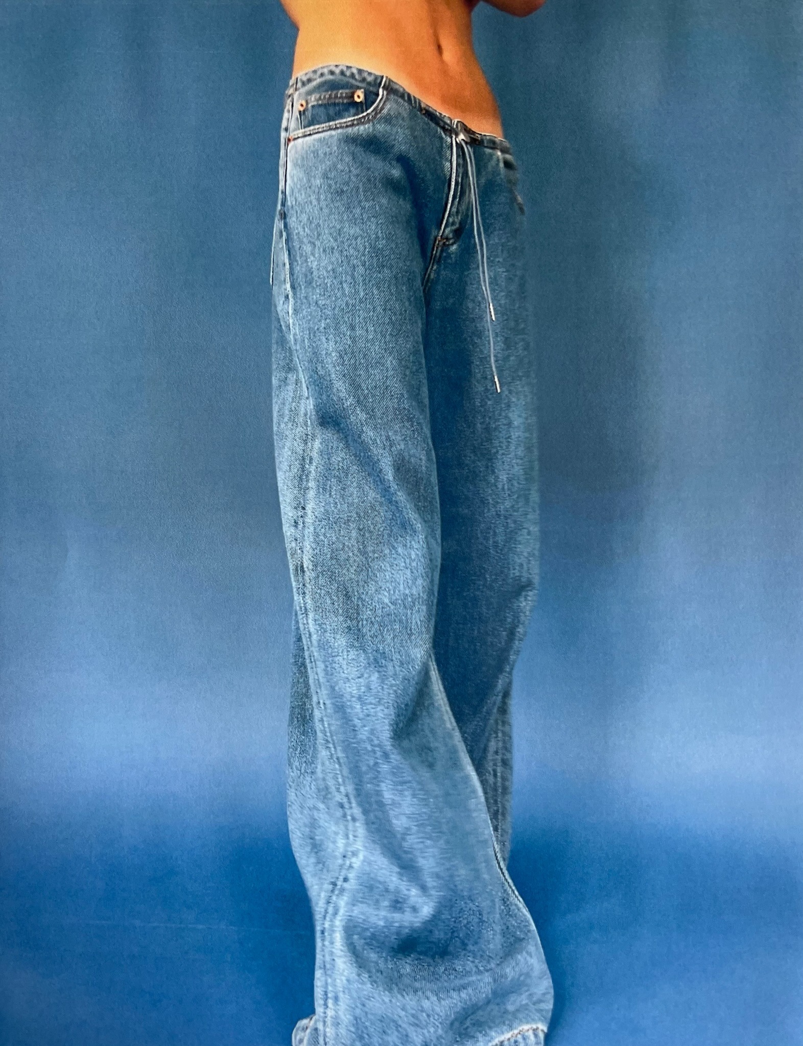 A person from the waist down wearing the cool jeans from still here