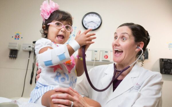 Doctor being silly with a young patient at St. Jude Children's Research Hospital